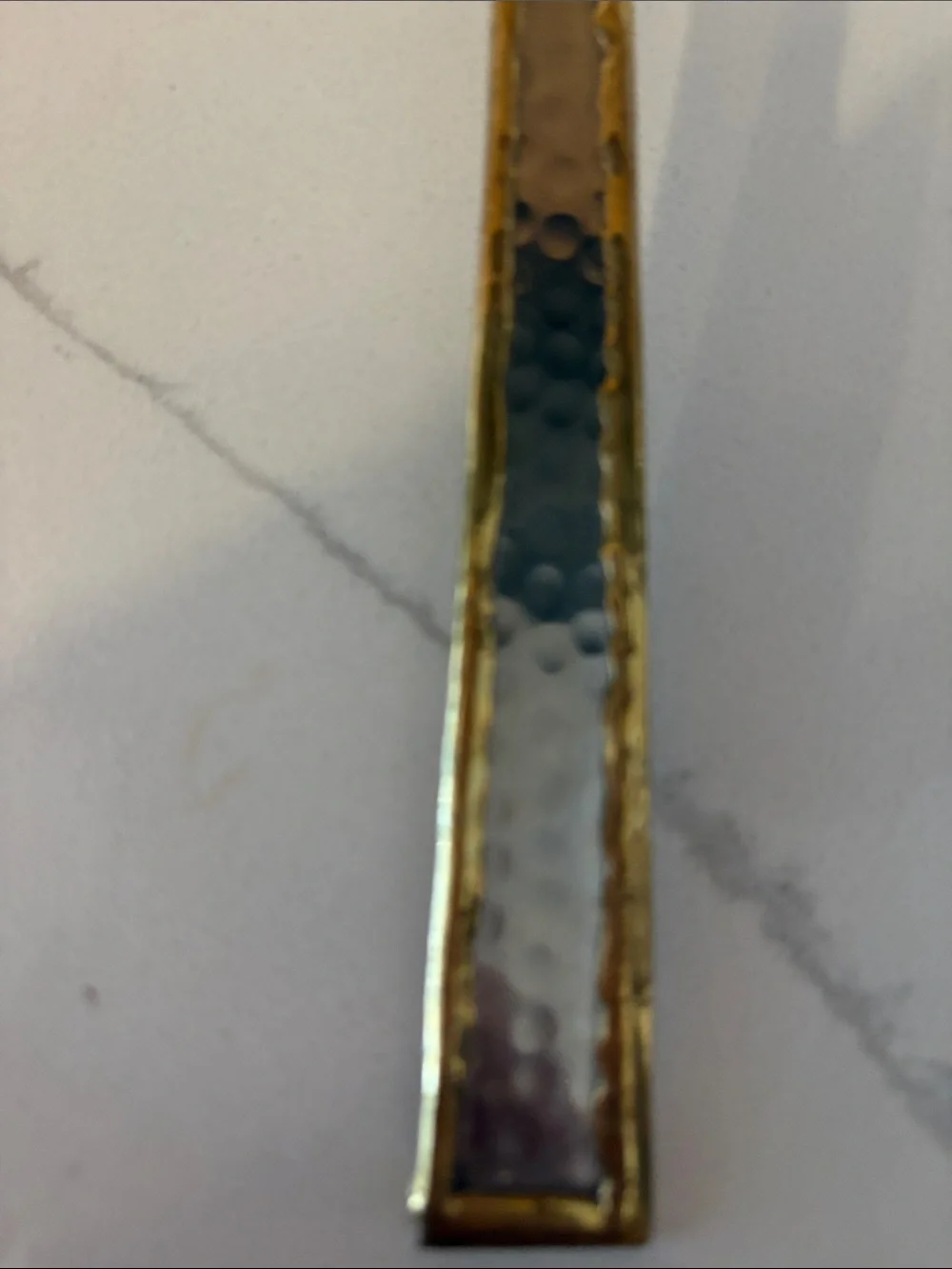 Silver cake server with hammered accents and gold trim